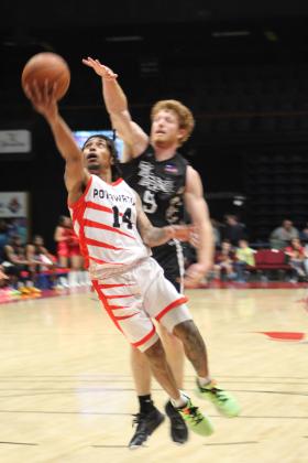 Potawatomi Fire Guard Rashaun Coleman tries for a basket in the last seconds of the first home game, March 17, at FireLake Arena. The Fire won against the Rockwall 7'ers, 152-96. Countywide &amp; Sun/Natasha Dunagan