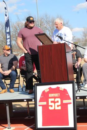 Shawnee Mayor Ed Bolt declares March 4 to be Creed Humphrey Day during the celebration at Shawnee High School Saturday. Humphrey grew up in Shawnee, where he played football and was in wrestling. Countywide &amp; Sun/Natasha Dunagan