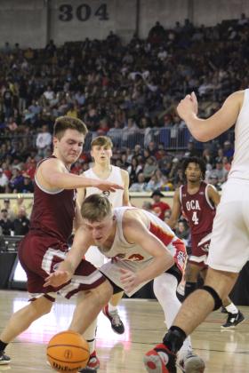 Dale junior Dayton Forsythe keeps control of the ball as he dribbles past an OCA defender during the fourth quarter of the Class 2A State Championship on March 11. Countywide &amp; Sun/Natasha Dunagan