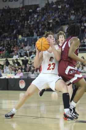 Dale junior Deken Jones drives to the basket during the Class 2A State Championship game against Oklahoma Christian Academy (OCA) on Sat., March 11. The Dale Pirates won, 78-52. This is their second year in a row to be state champions, and their record is 32-0. Countywide &amp; Sun/Natasha Dunagan