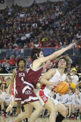 Dale junior Deken Jones looks for the hoop but is fouled in the fourth quarter of the Class 2A State Championship game against Oklahoma Christian Academy (OCA) on Sat., March 11. The Dale Pirates won, 78-52. This is their second year in a row to be state champions, and their record is 32-0. Countywide &amp; Sun/Natasha Dunagan