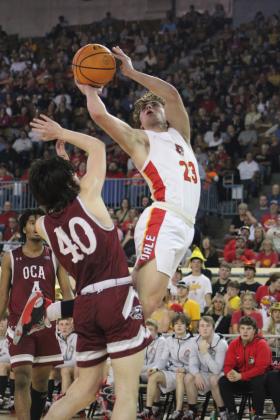 Dale junior Deken Jones tries to get past the OCA defense and shoot behind him but is fouled in the fourth quarter of the Class 2A State Championship game  on Sat., March 11. The Dale Pirates won, 78-52. This is their second year in a row to be state champions, and their record is 32-0. Countywide &amp; Sun/Natasha Dunagan