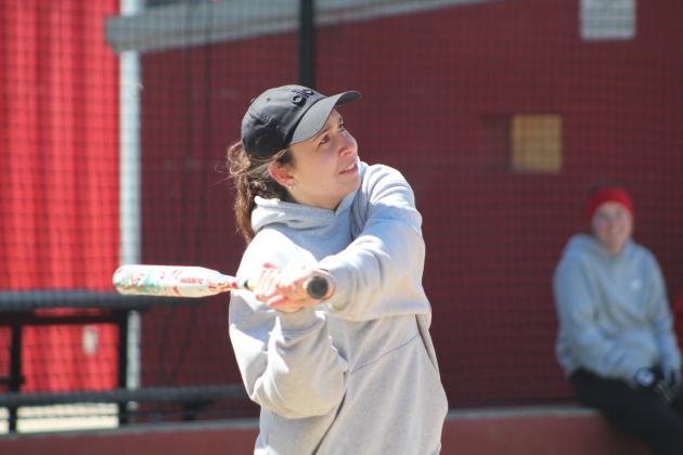 Dale 2018 graduate London Calvillo keeps her eye on the ball during the First Annual Dale High School Alumni Slowpitch Softball Game on March 18. Countywide &amp; Sun/Natasha Dunagan