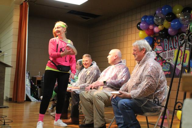 Tecumseh Internship Program Coordinator Pam Robinson smiles at the audience before giving Tecumseh Superintendent Robert Kinsey a whipped cream “pie” in the face.