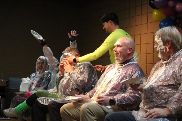 Luke Fugate, owner of the Rustic Rose, slams a whipped cream "pie" in the face of Tecumseh Police Chief J.R. Kidney at the Tecumseh Chamber of Commerce Auction on Feb. 23. Tickets were drawn for the opportunity to pie Kellie Clay, Becky Webb, Kidney, Robert Kinsey or Randy Gilbert. Countywide &amp; Sun/Natasha Dunagan