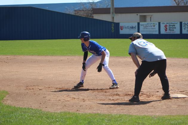Bethel senior Bronc Robbins watches for a chance to steal, as alum Brady Sullivan, Class of 2016, plays first base during the Bethel Baseball Bash on March 4. Countywide &amp; Sun/Natasha Dunagan
