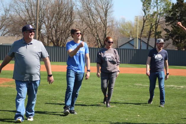 Four Arvest Bank associates threw out the first ball(s) for Shawnee High School’s first home baseball game on March 4, then got fist bumps from the team. Arvest was the largest sponsor and bought naming rights to the new electronic scoreboard. Shown, from left, are Community Bank President Brian Nave, Assistant V.P. and Business Banker David Dinsmore, Senior V.P. and Branch Administrator Jill Rawls., and Senior V.P. and Senior Client Advisor Kirk Israel. Countywide &amp; Sun/Natasha Dunagan