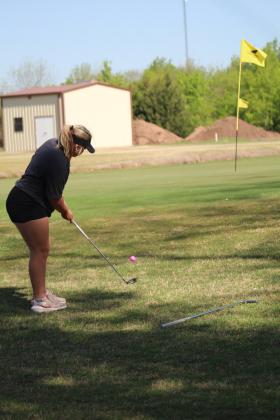 Tecumseh senior Paige Lowther putts to the fifth hole during the Tecumseh Girls Golf Invitational on April 18. Lowther scored 113 at the tournament. Countywide &amp; Sun/Natasha Dunagan