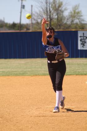 Bethel freshman Alexis Tucker lobs the ball toward home during the first inning of the Mounds game on April 13. Played at Bethel in the Dale Festival, the Lady Wildcats won this game, 12-2, but lost their next three games with Prague, Shattuck and Morrison. Countywide &amp; Sun/Natasha Dunagan