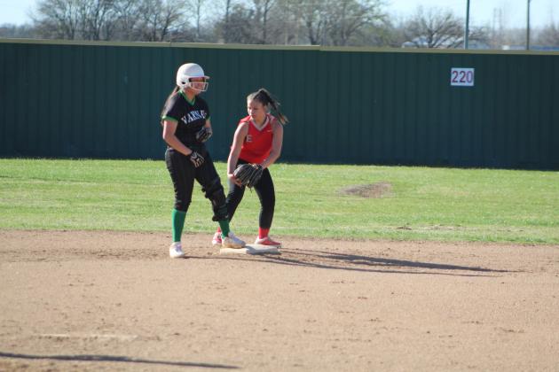 Earlsboro's Sierra Streater tries to tag a Varnum runner at second base, but she's already safe, during the Little River Slow Pitch Tournament held at FireLake Ball Fields on April 3. Countywide &amp; Sun/Natasha Dunagan