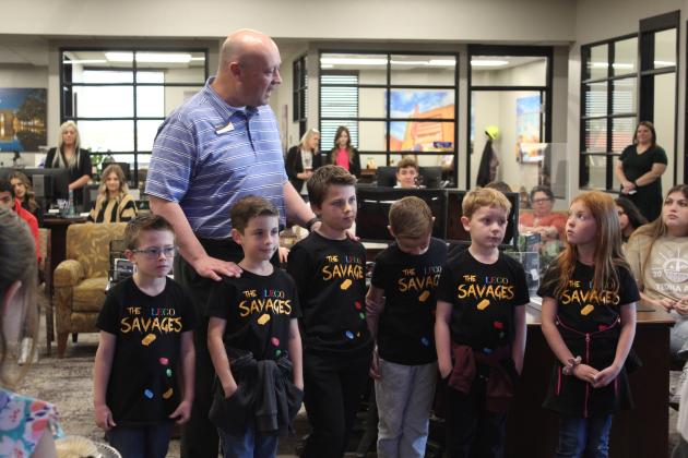 BancFirst President Casey Bell speaks about the Barnard Elementary LEGO Savages team on April 6 during the bi-annual school donation. The LEGO League team was one of 24 school organizations and departments to receive grants. They are raising money for a trip to the FIRST Robotics World Festival in Houston, April 19-22. Countywide &amp; Sun/Natasha Dunagan