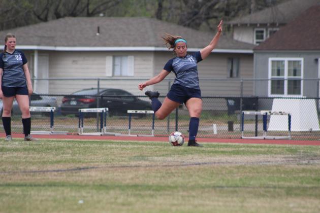 Shawnee's Kalieo Citizen punts the ball in the Sapulpa game on April 4.