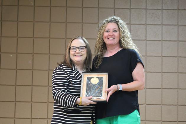 TECC Principal Tammy Giaudrone presents Jami Gates with the Lola C. Durham Award.