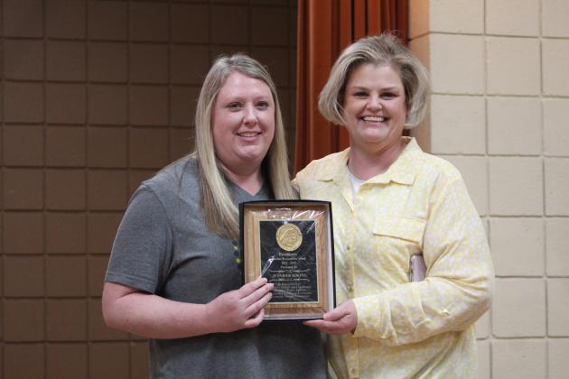 Barnard Elementary Principal Karla Buchanan, right, presents the Presidents' Award to Jennifer Adkins.
