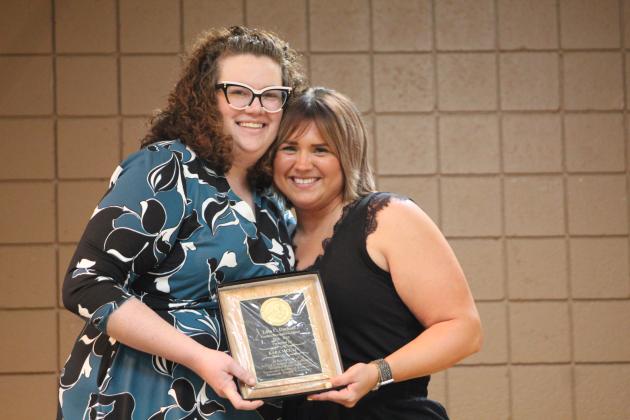 Cross Timbers Principal Alisha Jonker presents the Lola C. Durham Award to Kara McLain.
