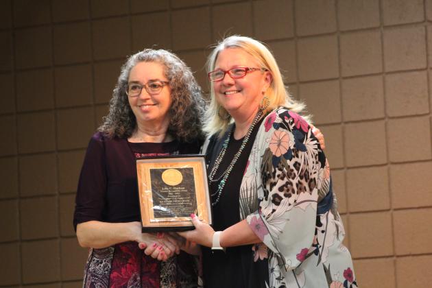 Tecumseh Middle School Principal Sarah Flowers, right, presents the Lola C. Durham Award to Elizabeth Martin.