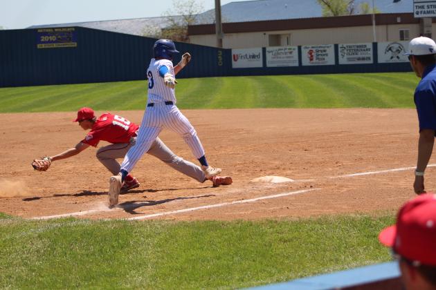 Bethel's Matthew Sharp runs to first base before being tagged in the home game with Prague on April 14. The Wildcats won, 9-1. Countywide &amp; Sun/Natasha Dunagan