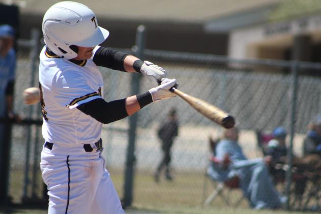 Tecumseh sophomore Xavier Ellis prepares to hit a single in the second inning of the home game against Harrah on April 1. The Savages lost, 6-7. Countywide &amp; Sun/Natasha Dunagan