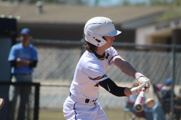 Tecumseh junior Rowdy Kinsey makes contact with the ball during the second inning of the home game with Harrah on April 1. The Savages lost, 6-7. Countywide &amp; Sun/Natasha Dunagan