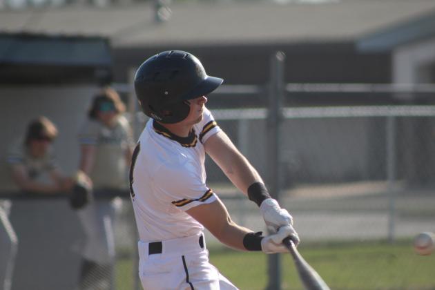 Tecumseh junior Bryson Smith lines up with the ball in the third inning of the home game with Inola on April 10. The Savages lost, 6-11. Countywide &amp; Sun/Natasha Dunagan