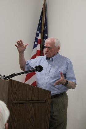 Vietnam Veteran Danny Glenn describes a "gong" made from a 120 millimeter gun shell hung from a tree and used to wake them up in one of the POW camps where he was held prisoner for six years. Glenn spoke about his experiences at the Pottawatomie County Historical Society on May 4. A bronze plaque outside the museum was dedicated to Glenn that day. Countywide &amp; Sun/Natasha Dunagan