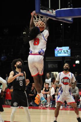 Potawatomi Fire Forward K.D. Moore makes a slam dunk in the second quarter of the home game on April 29. Moore tied with fellow forward Ruston Hayward at 19 points to lead the game, according to potawatomifire.com. The Fire beat the 7'ers, 142-94, for a seven-game winning streak. Countywide &amp; Sun/Natasha Dunagan