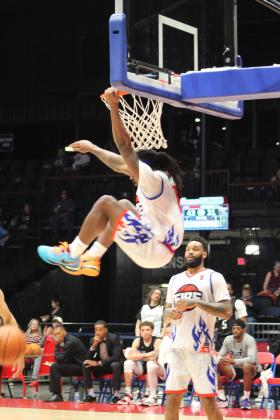 Potawatomi Fire Forward K.D. Moore makes a slam dunk in the second quarter of the home game on April 29. Moore tied with fellow forward Ruston Hayward at 19 points to lead the game, according to potawatomifire.com. The Fire beat the 7'ers, 142-94, for a seven-game winning streak. Countywide &amp; Sun/Natasha Dunagan