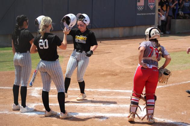 Tecumseh senior Bristin Hayes hits helmets with Serenity Jacoway and Katelyn Fleming after hitting a home run in the first inning of the Class 5A Slow Pitch State Quarterfinals on May 2. The Lady Savages won that game with Cache, 15-5, and lost in the Semifinals to North Rock Creek, 13-18. They end their season with a record of 28-9, and a rank of #3. NRC went on to win in the finals. Countywide &amp; Sun/Natasha Dunagan