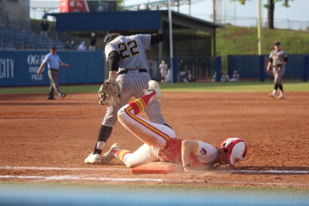 Dale junior Karsen Griggs slides into first base with a rough landing in the seventh and final inning of the Class 3A State Tournament Finals against Caddo on May 3. On the same day, the Lady Pirates beat Haskell, 11-4, and Tushka, 13-2, at the USA Softball Hall of Fame Stadium. They were named Class 3A Runners-Up after falling in the finals, 8-13. Countywide &amp; Sun/Natasha Dunagan