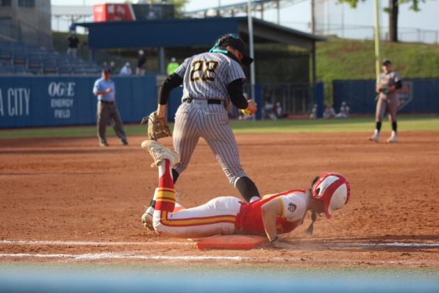 Dale junior Karsen Griggs slides into first base with a rough landing in the seventh and final inning of the Class 3A State Tournament Finals against Caddo on May 3. On the same day, the Lady Pirates beat Haskell, 11-4, and Tushka, 13-2, at the USA Softball Hall of Fame Stadium. They were named Class 3A Runners-Up after falling in the finals, 8-13. Countywide &amp; Sun/Natasha Dunagan