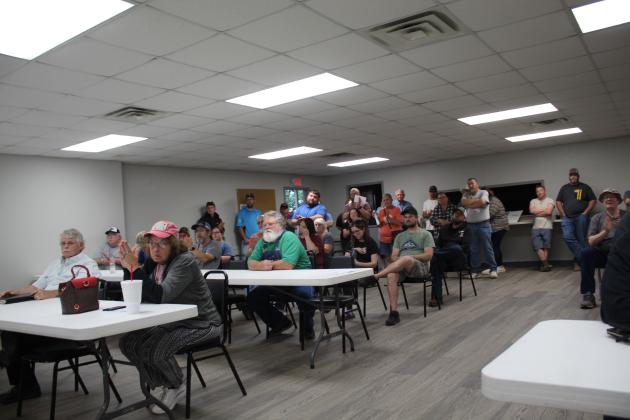 Some members of the audience at the May 15 Pink Town Council meeting applaud after the Pink Zoning Committee is disbanded. Countywide &amp; Sun/Natasha Dunagan