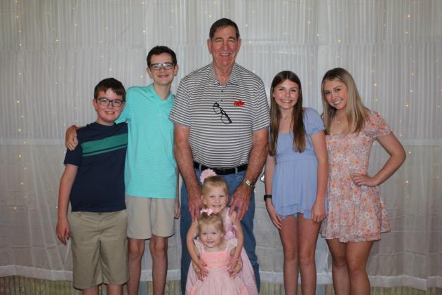 Dr. Bob Evans, DVM, plans to spend more time with his grandchildren in retirement. They are, from left, Cal Dunn, 11, Cooper Dunn, 14, Evans with Penny Evans, 4, and Isla Evans, 2, Kayley Evans, 14, and Gracelyn Higgins, 16. Countywide &amp; Sun/Natasha Dunagan