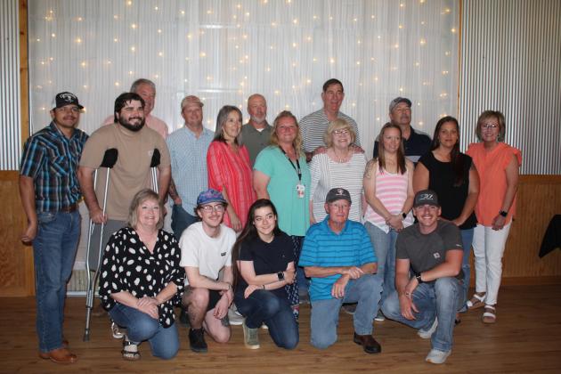 A retirement reception was held on May 21 at Crossing Hearts Ranch for Dr. Bob Evans, DVM, who founded the Tecumseh Veterinary Clinic in 1978. Here, he is posing with all those in attendance who worked with him.