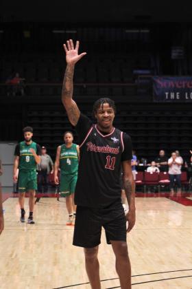 Potawatomi Fire Forward Ruston Hayward waves to the fans after a referees' decision that he was fouled in the fourth quarter on June 19. The Fire came from behind to win the TBL Central Conference Regionals against the Seattle Super Hawks, 124-114. Countywide &amp; Sun/Natasha Dunagan