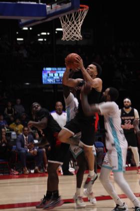 Potawatomi Fire Guard Deshawn Munson goes to the hoop and is fouled in the fourth quarter of the home game with the Wichita Sky Kings on May 25. Munson led with 27 points, and the Citizen Potawatomi Nation-owned TBL team won, 118-105. Then, in their last regular-season home game on May 27, they won against the Little Rock Lightning, 133-105. The Fire will play in the first-round Central Area playoffs today, June 1, at FireLake Arena and again on Saturday, if needed, according to www.potawatomifire.com.