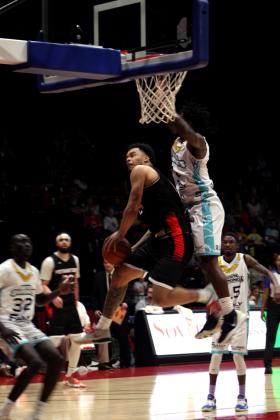 Potawatomi Fire Guard Deshawn Munson goes to the hoop and is fouled in the fourth quarter of the home game with the Wichita Sky Kings on May 25. Munson led with 27 points, and the Citizen Potawatomi Nation-owned TBL team won, 118-105. Then, in their last regular-season home game on May 27, they won against the Little Rock Lightning, 133-105. The Fire will play in the first-round Central Area playoffs today, June 1, at FireLake Arena and again on Saturday, if needed, according to www.potawatomifire.com.