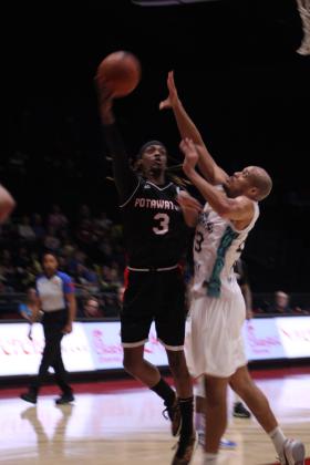 Potawatomi Fire Guard/Forward Ricky Artis II tries to shoot over a Wichita Sky King in the third quarter of the May 25 home game. The Fire won their last two regular season games - with 118-105 in that game and 133-100 in the May 27 Little Rock Lightning game - as well as all of their home games in their second season. They will be playing today (June 1) in their second Central Area first-round playoff game at FireLake Arena, according to www.potawatomifire.com. Countywide &amp; Sun/Natasha Dunagan