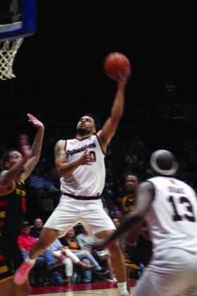 Potawatomi Fire Guard Deshawn Munson aims and hits the bucket in the second game of the TBL Finals with the St. Louis Griffins at FireLake Arena on June 26. They won 127-95 to force the third game on June 27. Countywide &amp; Sun/Natasha Dunagan