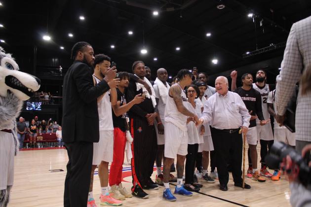 Chuck Guy shakes hands with CPN Chairman John "Rocky" Barrett after the CPN-owned Potawatomi Fire won the TBL National Championship on June 27 at FireLake Arena. Guy was named co-MVP for the league, along with 2022 MVP Deshawn Munson. Countywide &amp; Sun/Natasha Dunagan