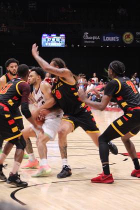 Potawatomi Fire Guard Deshawn Munson defends the ball against four Griffins before passing it in the fourth quarter of the TBL Championship on June 27 at FireLake Arena. In their third game with the St. Louis Griffins, the Fire won their first national title, 98-89, in just their second season. Countywide &amp; Sun/Natasha Dunagan