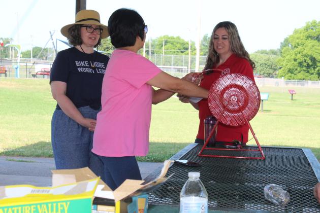 Lisa Watson, of the Gateway to Prevention TSET Healthy Living Program, draws a number, but the winner wasn't present to win $200.