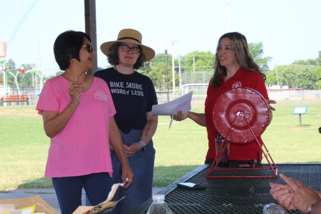 Lisa Watson, of the Gateway to Prevention TSET Healthy Living Program, draws a number, but the winner wasn't present to win $200.