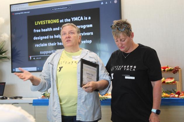 Livestrong Program graduate Heather Todd gives her testimony with the support of Health and Wellness Director LaDawn Hladik during the program's first graduation ceremony, held at First United Bank in Shawnee on June 8. Countywide &amp; Sun/Natasha Dunagan