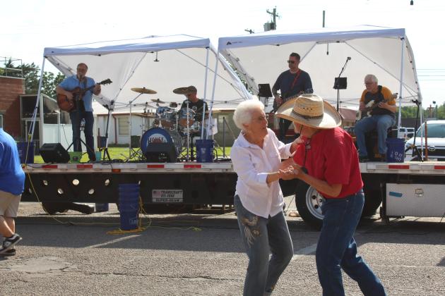 Rita Yarbrough of Shawnee and Jerry Yarbrough of Sparks dance as the House Special band plays during the Mingle on Main Street Block Party, June 8. Countywide &amp; Sun/Natasha Dunagan