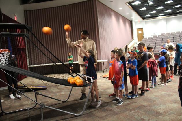 Oklahoma City Thunder Forward Ousmane Dieng shoots hoops with the YMCA Summer School campers.