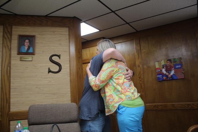 June 26, 2023 Shawnee School Board Meeting - Hug from Board President Clif Harden