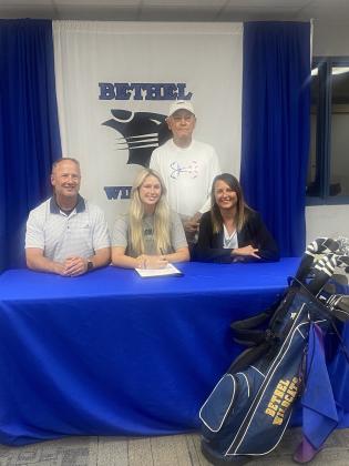 Bethel’s Kloee Nichols signs with Oklahoma Baptist University to continue her golfing game. Pictured with Kloee are her parents, Kevin and Kasie Nichols. Standing is Bethel Coach Tommy Block. Photo provided