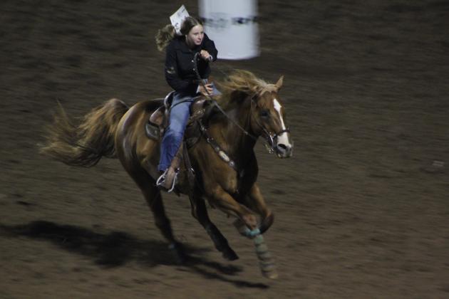 Avery Dockrey of Shawnee finishes her barrel ride.
