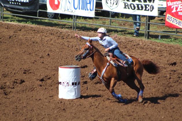 Payton Askins of Shawnee rounds the first barrel.