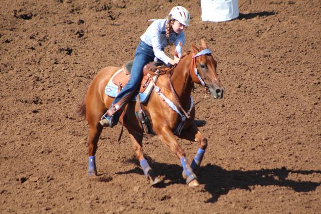 Payton Askins of Shawnee finishes her barrel race.